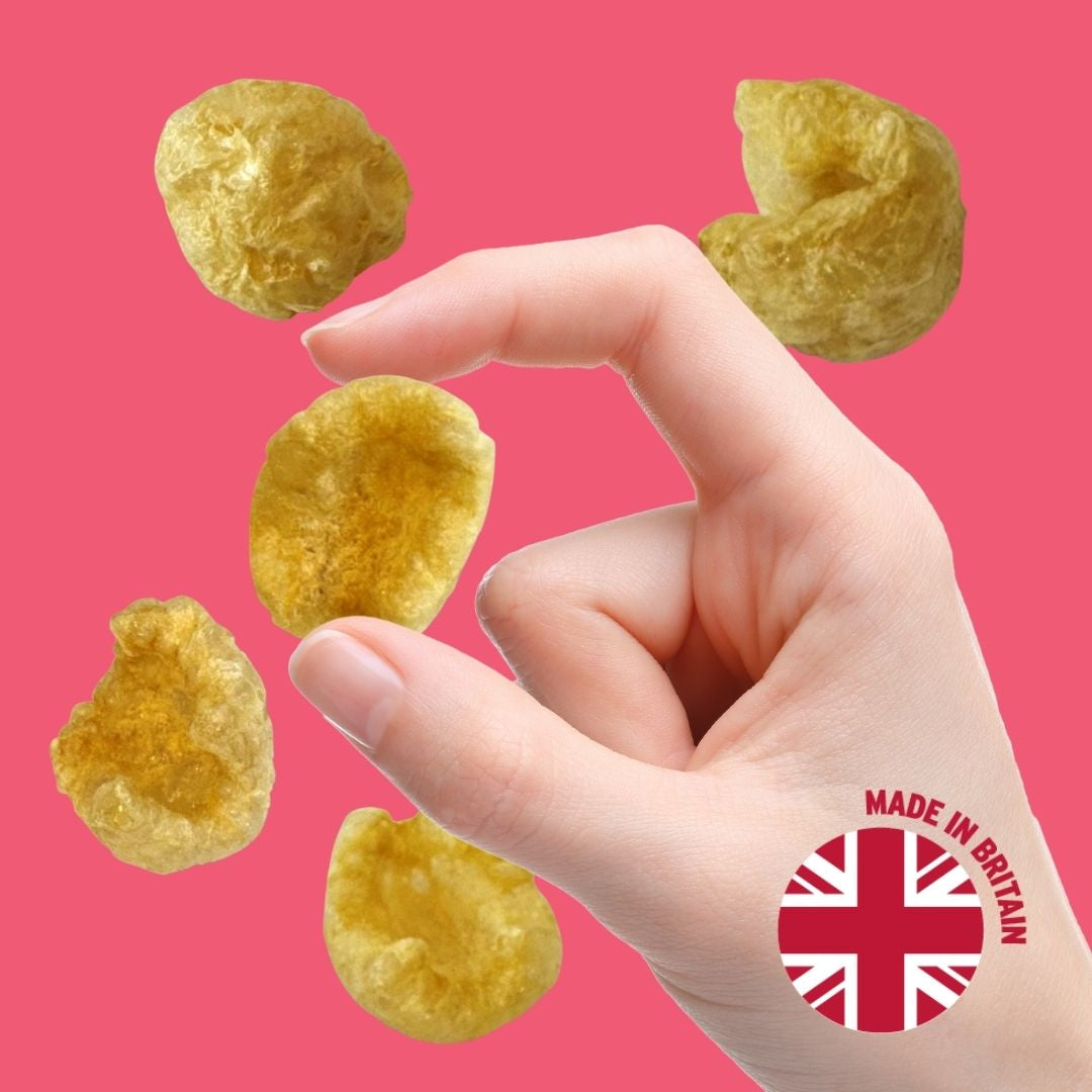 Hand holding pork chicharrónes
